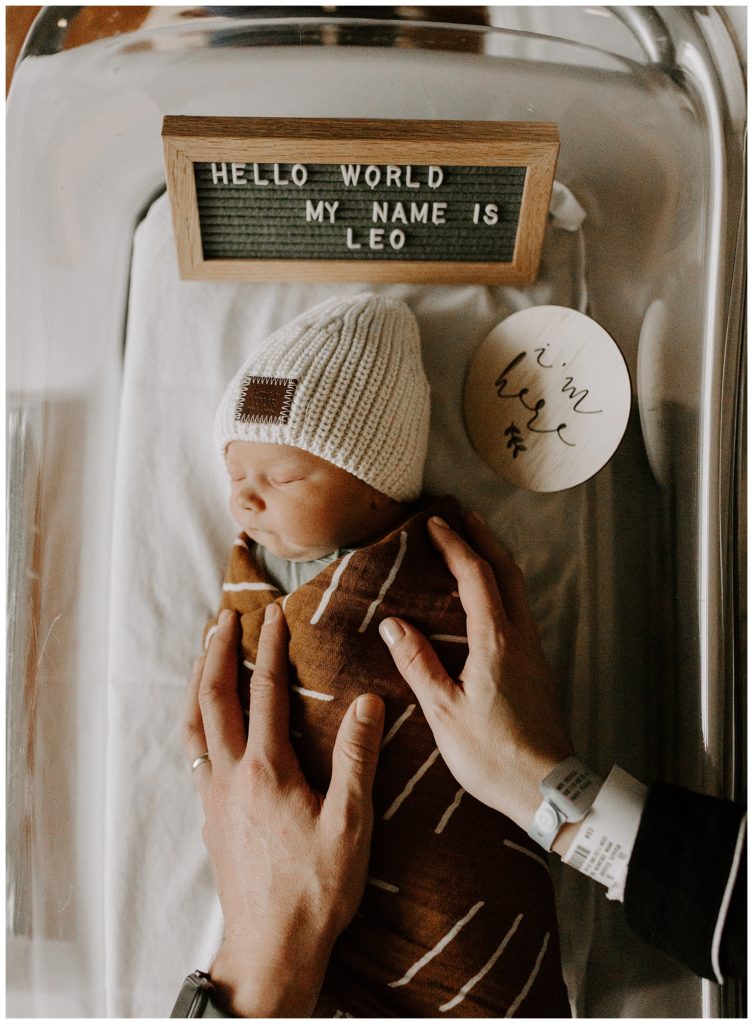 newborn in bassinet